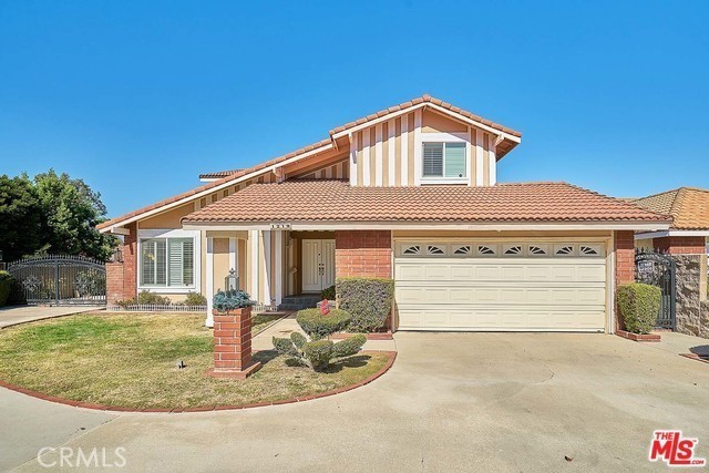 Beautiful House for family Located on highly demanding Walnut valley School Unified l District. 4 bed , 2.5 bath with classy hardwood and marble on main floor. It is bright and sunny with Cathedral style high ceiling in living room area. Formal dining area connects to open kitchen with granite counter tops, wood cabinets and marble floor. Totally new look in the master bathroom with upgraded sink and shower room. Over 10,000 sf. lot with beautiful city and mountain view from up stairs. Large back yard with covered patio with fully landscaped. Closed to shopping center, FWY 57 & 60 , restaurants and all schools.