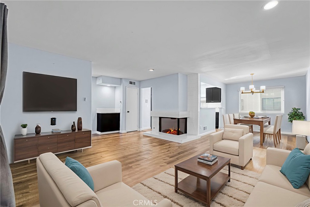 Tucked away in a prime Calabasas location, this updated tri-level townhome in Las Virgenes Village welcomes you! Looking for something light, bright, and inviting, this spacious home features three generously sized bedrooms and two-and-a-half bathrooms. The main level offers an open-concept living space with smooth ceilings, recessed lighting, laminate flooring throughout, and a cozy fireplace accented with great tile, making it a feature of the main floor but subtle, giving off a cozy vibe. The updated kitchen is a great space with Caesar stone countertops, a designer tile backsplash, stainless steel appliances, and a farmhouse sink and plenty of storage space and a good sized dining area, keeping the concept open and flowing nicely. Enjoy a quiet morning on your balcony just off the living room. Upstairs, all bedrooms are a good size with dual-pane windows and laminate flooring throughout, including a spacious primary suite with high ceilings and an en-suite bath. The additional full bathroom serves the secondary bedrooms, and there’s a convenient half bath on the main level for guests. The attached two-car garage offers direct access for ease and privacy. The community itself has great amenities, including a sparkling pool, relaxing spa, clubhouse, and beautifully maintained greenbelts and some utilities such as water, cable TV, and basic internet services, all this and more located within the award-winning Las Virgenes School District, with hiking trails, shopping, and so close to our beautiful beaches. This is Calabasas living at its best.