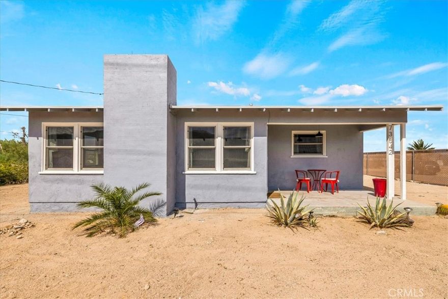 Welcome to your desert retreat in the heart of Twentynine Palms! This charming 2-bedroom, 1-bathroom home PLUS DETACHED GARAGE sits on a LARGE PRIVATE LOT, offering plenty of space to relax and enjoy the peaceful desert surroundings. Step inside to find a warm and inviting living area complete with a cozy fireplace, perfect for cool desert evenings. The home features an open and functional layout with a comfortable flow between the living, dining, and kitchen areas. A washer and dryer are also included for your convenience. The expansive backyard provides ample room for entertaining, gardening, or simply soaking in the serene atmosphere. Enjoy breathtaking desert views and sunsets from the rooftop patio, creating an ideal space for quiet relaxation or stargazing. Located just a short drive from Joshua Tree National Park, this home offers easy access to hiking, outdoor adventures, local restaurants, shops, and unique desert attractions. Whether you’re seeking a peaceful full-time residence, vacation getaway, or investment opportunity, this cozy home on a large private lot is ready to welcome you!