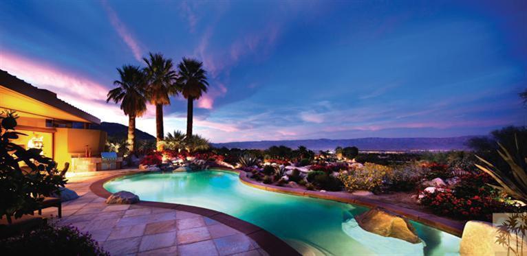 This desert contemporary offers views that take your breath away. One of BIGHORN's most spectacular views encompassing widespread down-valley, Chocolate Mountains, Canyons 6th Fairway, and waterfalls. The home offers a spacious open floor plan which showcases artistic niches, custom designed furnishings, media center, multiple seating areas, fireplace and sit down wet bar with sliders that open to an outdoor patio. High Performance kitchen with intimate media center and morning room. Dramatic dining room with custom designed table, dual buffets, artistic lighting with views to a lushly landscaped courtyard. Spa-inspired master retreat. Handsome office off the master with handcrafted desk, bookshelves and sitting area. Three spacious guest suites with private patios are great for entertaining family and friends. This property has everything you could want in a desert home including tuck-in sliders for easy indoor/outdoor living.