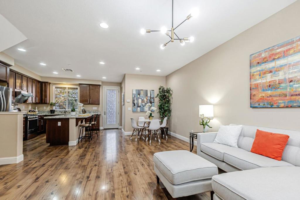 This stunning home is located in the highly desirable Avenue Community, offering a prime location with breathtaking mountain views. A model-quality home with no neighbors above or below, it features a side-by-side two-car garage with ample storage space. Designed with a modern and elegant touch, the home boasts an open-concept layout with high ceilings, a gourmet kitchen featuring granite countertops, a large island, stainless steel appliances, contemporary cabinetry, and recessed lighting. The entire home has beautiful flooring expect the staircase. Fresh painting. Dual-zone central A/C and heating, tankless water heater, and a private patio. The low HOA fees include a wealth of amenities, trash removal, common area insurance, multiple playgrounds, and lush greenbelt areas. Conveniently located within walking distance to the Milpitas BART station, the new Mattos elementary school, shopping centers, and the Great Mall, with easy access to public transportation, freeways, and major high-tech companies. No rental restrictions. Wont last long!