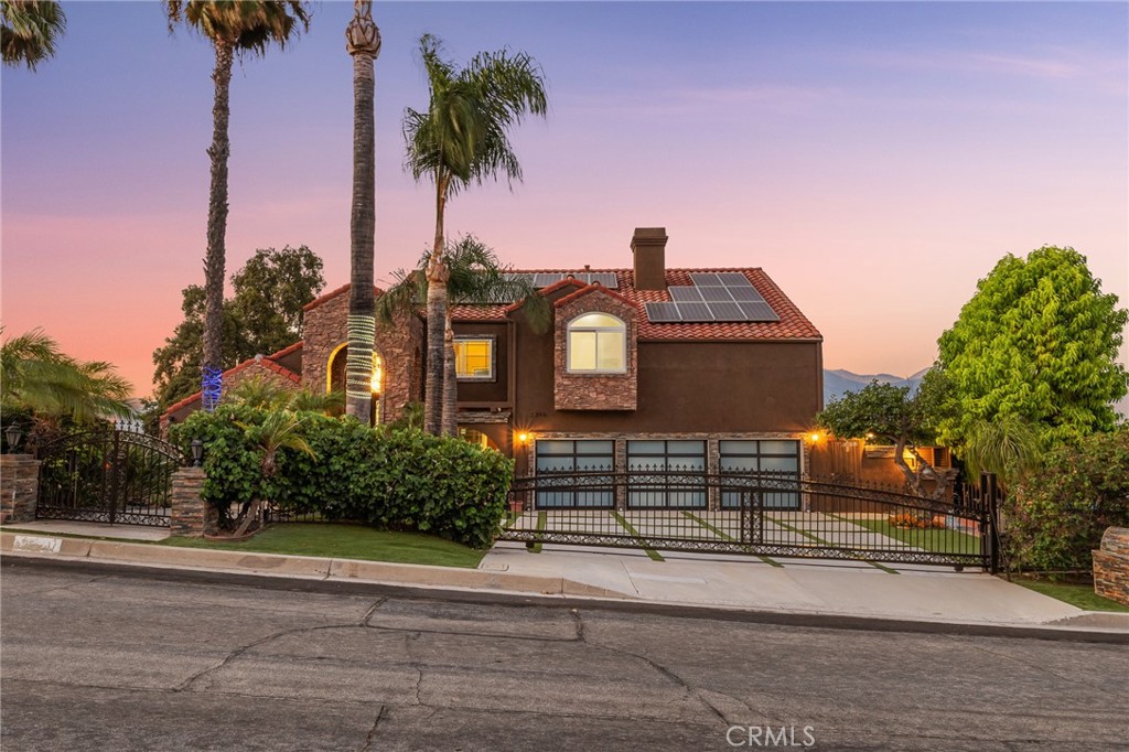 View, view, view! Nestled on an elevated lot in the prime hills of Chino Hills, 2396 Scenic Ridge Drive offers breathtaking mountain and canyon vistas from most rooms of the home. This 5-bedroom, 6-bathroom estate spans 4,285 sq. ft. on a beautifully landscaped 14,412 sq. ft. lot (0.33 acre), blending natural beauty with modern convenience.
The versatile floor plan includes two bedrooms and a private office on the main level, perfect for multi-generational living or working from home, while the second floor features three additional bedrooms, each designed to capture serene panoramic views. Expansive windows, soaring ceilings, and open-concept living areas ensure seamless indoor-outdoor flow for both entertaining and everyday living.
Additional upgrades set this home apart: fully paid-off solar panels, a whole-house water softener, and a drinking water purification system. The front yard is beautifully landscaped with mature trees, adding privacy and curb appeal. Its location is ideal—easy access to the 71, 57, and 60 freeways places you minutes from Costco, 99 Ranch Market, and The Shoppes at Chino Hills. With no HOA and situated in a quiet, desirable neighborhood, this property combines breathtaking views, sustainable living, and unmatched convenience.