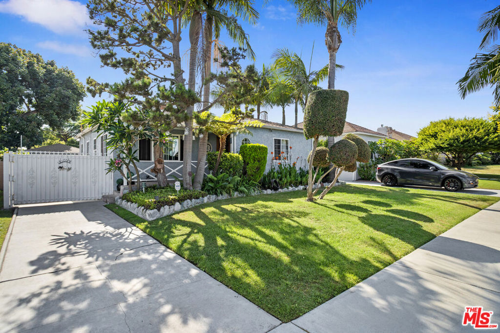 A Cozy Traditional Baldwin Vista Neighborhood Home set on a quiet tree lined street .Bright and open Living Room with skylights and large windows, adjacent to a Dining Area next to the kitchen with nice appliances. In the middle of the Living Room is the double sided charming fireplace. The other side of the fireplace is the step down Master Suite with the gorgeous oversized master bathroom. Through the Master suite is the Frenchdoors directing you to the private backyard landscaped with mature trees and native plants. There is a good and well size storage shed. The detached 2 car garage with a long gated driveway is now a Playroom. There is an $8,000 worth of water filters all through out the house. There is an automatic sprinklers for front and backyard. Centrally located, easy access to shopping, parks, Metro Station and quick commutes to Culver City, Santa Monica and LAX. Nearby is Kenneth Hahn Park offering Hiking Trails and Picnic Areas and panoramic views.