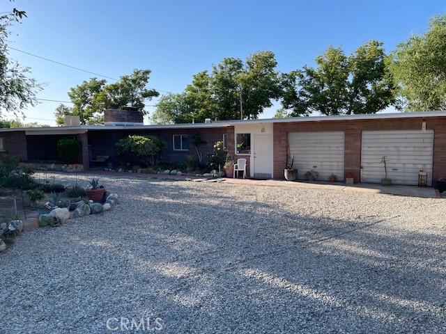 Charming unique ranch style block house, 3 bedrooms 1 & ¼ bathrooms. Owner has maintained/ updated the house while keeping the original charm of 1955. It’s a time capsule! Turnkey to live in or make it your own. New carpet in living room, hall, and bedrooms, newer blackout draperies throughout the house. Newer copper plumbing, new roof, New evaporative cooling. New Water heaters, quarter bathroom has been remodeled with new vanity and toilet. New laminate floors in kitchen and laundry room. Full bathroom is original and in great shape. The kitchen is also original and in good shape.
This property is 24,000 SQFT with mature trees front & back of property. Nice island in the circle driveway. The RV access takes you to a back yard that’s a blank canvas! With decomposed granite, three out buildings, a block wall that separates the back into two sections. Could be used for, animals, storage, ADU or garden. The possibilities are endless!