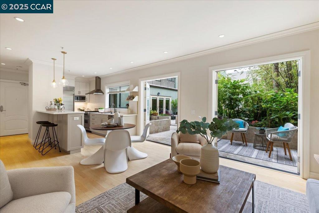 Experience the best of San Francisco living in this stunning unit located in the heart of the Inner Sunset. Step inside the light-filled 2 bedroom and 1.5 bathroom home to find an open floor plan that extends outdoors to your private courtyard, making it ideal for entertaining. The fully renovated kitchen showcases top-of-the-line appliances from Sub-Zero, Viking, and Bosch. With plenty of storage and sleek finishes, this culinary space is as functional as it is beautiful. Throughout the home, you’ll find thoughtful updates, including matching french patio doors with blinds between the glass and updated flooring in the main bathroom. The unit also features integrated smart home technology, including automated wood blinds and smart light switches, adding a layer of modern convenience. Additional conveniences include assigned parking with EV charger and laundry in unit. Just moments from Golden Gate Park, local shops, cafes and restaurants on 9th ave. Link to video clip https://vimeo.com/1118272103