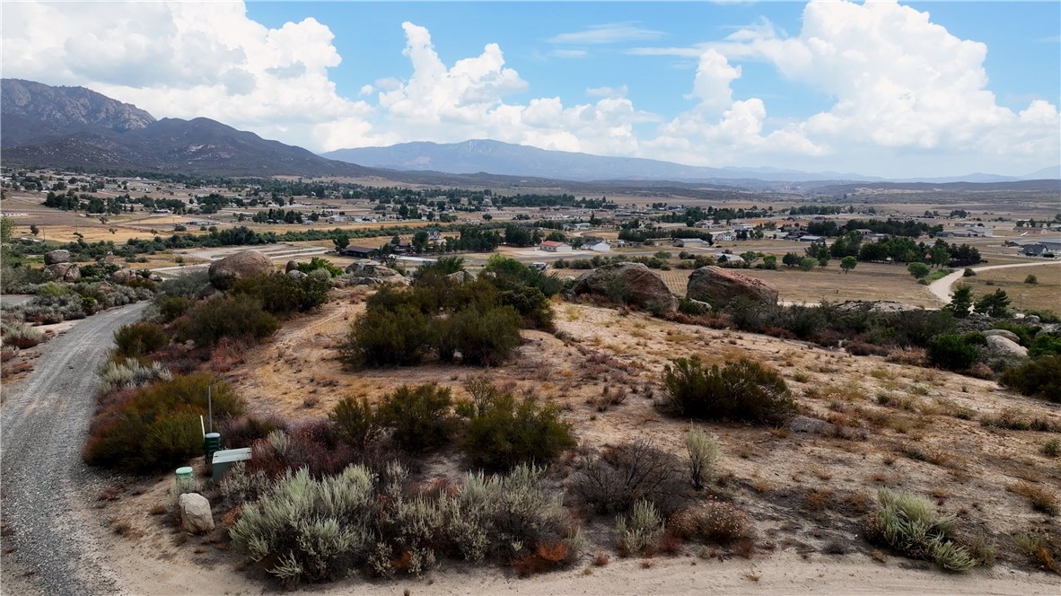 2.68 Acre lot in beautiful Lake Riverside Estates. This lot has a LAKE VIEW, Mountain view, Valley view. The lot has a gentle slope on the front side with cleared land and then gorgeous giant boulders on the bottom portion of the lot. End of Cul-de-sac location for added privacy. Located at 3500 FT Elevation you will love the mild 4 season weather. HOA Amenities include stocked lake with picnic areas and playground, private airport, community equestrian center, maintained roads, gated community, security and community pool and building. Lake Riverside Estates is located 30 minute drive to Temecula and less than 1 hour to Palm Desert. Close to the nearby mountain communities of Julian and Idyllwild. *** Bank Financing available with 15% down, call listing agent or have your buyers agent contact listing agent for more details**