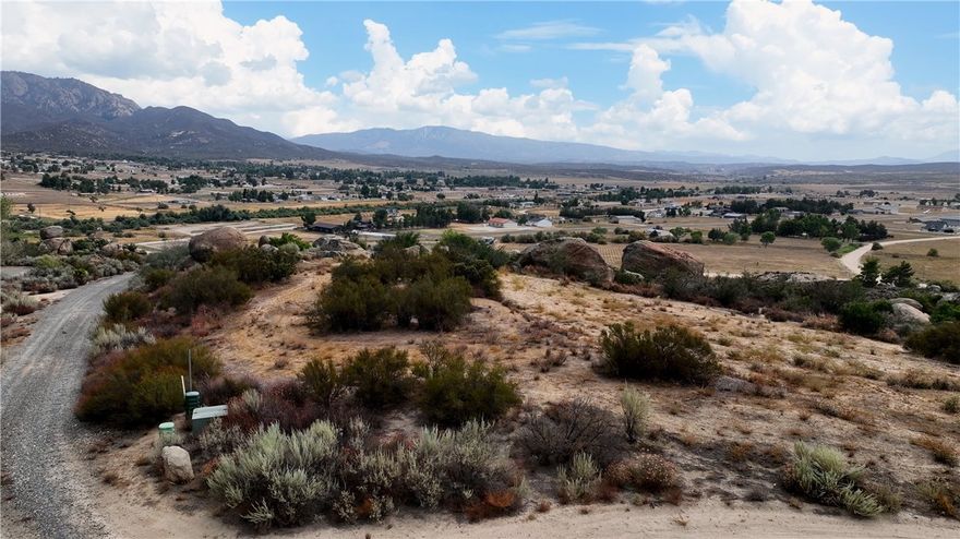 2.68 Acre lot in beautiful Lake Riverside Estates. This lot has a LAKE VIEW, Mountain view, Valley view. The lot has a gentle slope on the front side with cleared land and then gorgeous giant boulders on the bottom portion of the lot. End of Cul-de-sac location for added privacy. Located at 3500 FT Elevation you will love the mild 4 season weather. HOA Amenities include stocked lake with picnic areas and playground, private airport, community equestrian center, maintained roads, gated community, security and community pool and building. Lake Riverside Estates is located 30 minute drive to Temecula and less than 1 hour to Palm Desert. Close to the nearby mountain communities of Julian and Idyllwild. *** Bank Financing available with 15% down, call listing agent or have your buyers agent contact listing agent for more details**