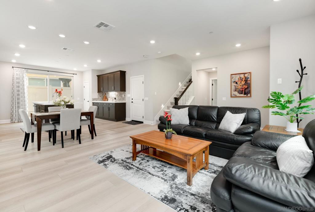 Experience modern living in this nearly new detached home, ideally located in the highly desirable Pacific Village community of Rancho Peñasquitos. Built just 5 years ago, this residence offers 4 bedrooms, 3 full baths, a versatile loft, and a convenient upstairs laundry room with sink. A coveted first-floor bedroom adds comfort and flexibility. The spacious primary suite features a well-appointed bath and large walk-in closet, with additional bedrooms also offering walk-ins for ample storage. The open-concept design highlights a gourmet kitchen with pantry and effortless flow to a private backyard—perfect for entertaining or everyday living. Pacific Village residents enjoy low HOA fees and resort-style amenities including a pool, playground, picnic and BBQ area, and dog park. Zoned for award-winning Poway Unified schools and minutes to Carmel Mountain Plaza, Plaza Rancho Peñasquitos, shopping, dining, and freeway access—this home presents a rare opportunity in one of San Diego’s most sought-after communities.