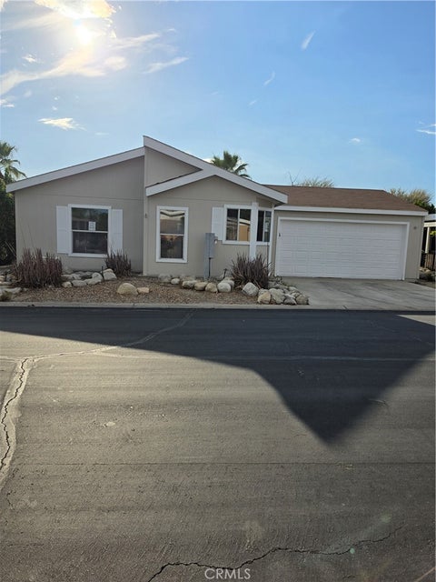 Photo of 73450 Country Club Drive #315, Palm Desert, CA 92260 (MLS # OC26225305)