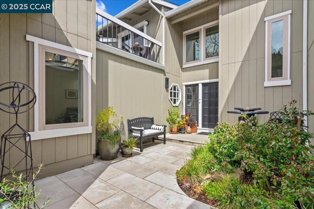 Experience this blend of elegance & comfort where every detail is curated for exceptional living with upgrades galore. Enter through a beautifully landscaped courtyard featuring yard lighting and soothing water fountain. Inside, hardwood flooring seamlessly connects the common areas, adding warmth and sophistication. The heart of the home is the remodeled kitchen, with modern cabinetry, sleek quartz countertops, and custom backsplash illuminated by recessed lighting and pendant lights over the breakfast bar. The family room invites you to unwind with fireplace & skylight. The living room, also with a gas fireplace, and the formal dining room provide views of the backyard through Andersen doors, enhancing indoor-outdoor flow. The primary suite features vaulted ceiling and custom closets, with a private bathroom updated with an oversized shower, skylight, and quartz counters. Two additional bedrooms, one with a private sunny deck, share an updated bathroom, with convenient indoor laundry. The backyard is perfect for relaxation & entertaining, featuring secluded two-tier Timber Tech deck with irrigated planters. Neighborhood swimming pool at the end of the court plus full membership and use of all MCC's fabulous new amenities!