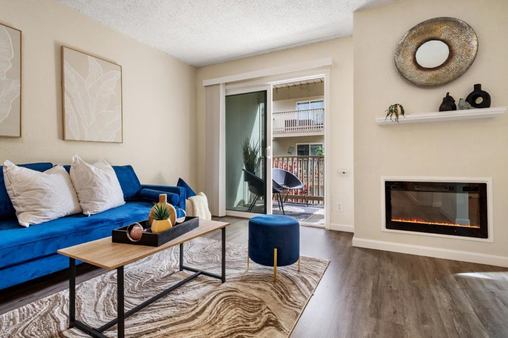 Cozy 2nd-floor studio with sleep alcove, freshly painted and featuring luxury vinyl plank flooring. Enjoy a beautifully remodeled kitchen with stainless steel appliances, quartz countertops, and sleek new cabinetry. The living area is warmed by an electric fire insert, and a walk-in closet with custom organizers adds plenty of storage. Step out onto your spacious deck, perfect for barbecues or relaxing outdoors. Conveniently located close to the laundry room, elevator, and exterior stairwell, this home overlooks the peaceful interior courtyard. This unit includes 1-car parking and access to resort-style community amenities: pools, spa, tennis courts, basketball court, dog run, gym, and clubhouse. Ideally situated near major highways, shopping, restaurants, and more!