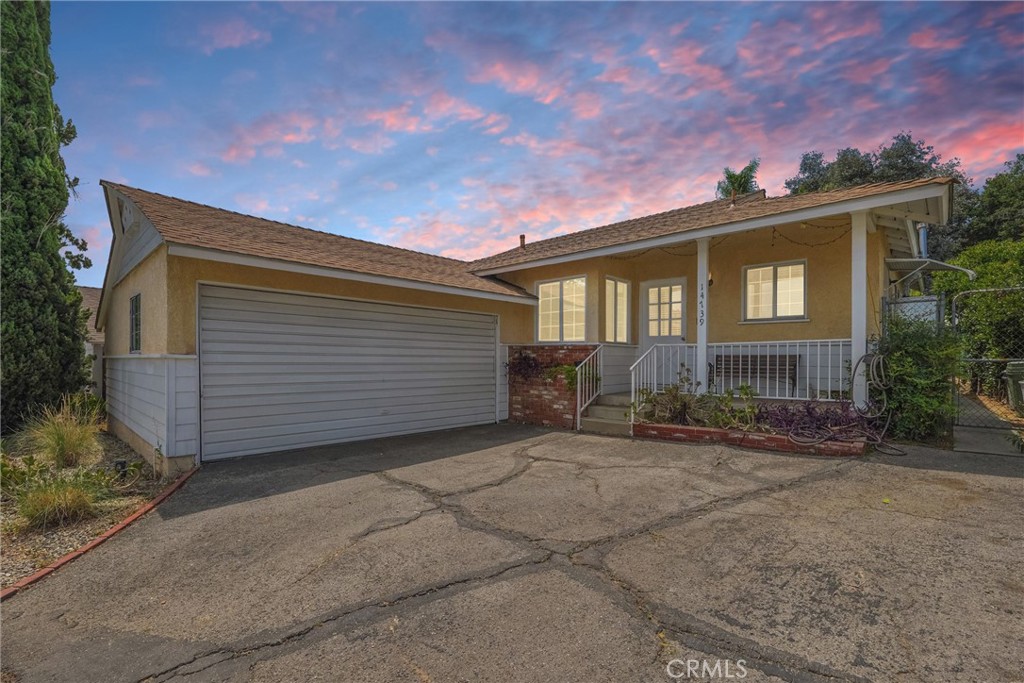 Charming single-family residence nestled in the heart of Sylmar! This beautifully maintained 3-bedroom, 1.5-bathroom home is situated on a spacious 7,430 sq ft lot, offering the perfect combination of comfort, privacy, and practicality. Move-in ready and full of potential, this one-level residence is ideal for families, first-time buyers, or investors looking for an opportunity in a well-established neighborhood. Inside, the home boasts an inviting floor plan featuring a spacious living room complete with a cozy fireplace and abundant natural light. The interior has been thoughtfully with a mix of plush carpet and durable laminate flooring throughout. The kitchen is outfitted with tile countertops and equipped with appliances including a gas oven, gas range, microwave, dishwasher, and refrigerator—making meal prep a breeze. Ceiling fans and wall-mounted A/C units help keep the home cool and comfortable all year round. All bedrooms are conveniently located on the main floor, including the primary suite which features an ensuite bathroom and walk-in shower. The second half bathroom offers convenience and functionality for the rest of the household. A dedicated in the garage has washer and gas dryer hookups which adds to the home’s efficiency. Double-pane windows provide energy efficiency, and the home is secured with smoke detectors for peace of mind. Outside, you’ll find a generously sized backyard ideal for entertaining, gardening, or simply enjoying the California sunshine. A front porch welcomes guests, while the front yard offers great curb appeal. The detached garage with a single door and front-facing entry provides convenient parking and additional storage. Located on a quiet street with easy access to local schools, parks, and shopping, this property also benefits from nearby street lighting, curbs, and sidewalks. Situated in the Los Angeles Unified School District, this home offers a prime location at an unbeatable value. Don’t miss your opportunity to own this Sylmar gem—schedule your private tour today and imagine the possibilities that await!