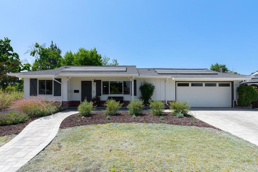 PARKSIDE CORNER PROPERTY W/ 2 PRIMARY SUITES | Nestled across from Hathway Park, this inviting home on a prime corner lot enjoys serene parkside views, extensive upgrades, and a flexible floorplan with TWO primary suites. Gathering areas trimmed with crown molding open to a courtyard-style patio overlooking the spacious backyard, perfect for indoor-outdoor ease. A pocket door reveals an office/family room, while primary suites are privately arranged at the rear the home, ideal for extended families or long-term guests. The attached two-car garage with paver drive is oversized with a storage room and space for overhead storage. Mature fruit trees and rubber flooring make the private backyard an excellent retreat for family activities. Includes a refinished kitchen, beautiful native landscaping, solar power, central AC, dual water heaters, modern lighting, luxury floors, and much more. Step over to the park while moments from shopping, dining, and entertainment at Westgate Center! Near freeways and expressways, major shopping centers, and Moreland and Campbell Union schools (buyer to verify).