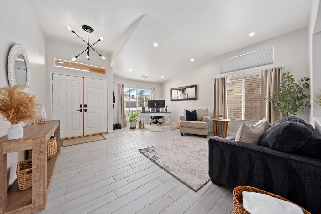 Upgraded, Smart, and Ready to Impress - This beautifully and tastefully updated 4-bedroom, 2.5 bath home is in the highly sought-after gated community of Starlight Dunes and boasts an open-concept floor plan with 10+ ft high ceilings. Nestled on a quiet cul-de-sac this 2,376 sq ft single-story retreat combines thoughtful upgrades, modern tech, and an incredible outdoor living space. The family room and dining room are open to the kitchen with a large eating area that can comfortably accommodate formal gatherings of family and friends. Outside you will find a large covered outdoor space boasting a double insulated covered patio with recessed lighting, fan and 55'' Outdoor TV. With peek-a-boo mountain views, a low maintenance yard, and a fully fenced-in pool and spa. The high-ticket items have been done for you and move in ready. Recent major improvements include: New A/C units, new spa heater, new water heater, epoxy garage floor, garage storage shelves, workbench, and tool boxes, Ecobee smart thermostats (Dual zones), programmable recessed lighting throughout, and Ring cameras installed. This home is fully equipped with $40K+ in included tech and essential mechanical updates. The primary bedroom has a wall mounted 64'' TV and Soundbar, both of which stay for your enjoyment. Conveniently Located near IB league schools, upscale dining, shopping and El Paseo - the Rodeo Drive of Desert shopping. And with 100+ golf courses in the area, you are guaranteed a tee time. This home offers everything you could possibly need to start enjoying a true desert experience from the moment you walk through the door. Whether you're looking for a desert retreat or a full-time residence, Zenith Way delivers the total package.