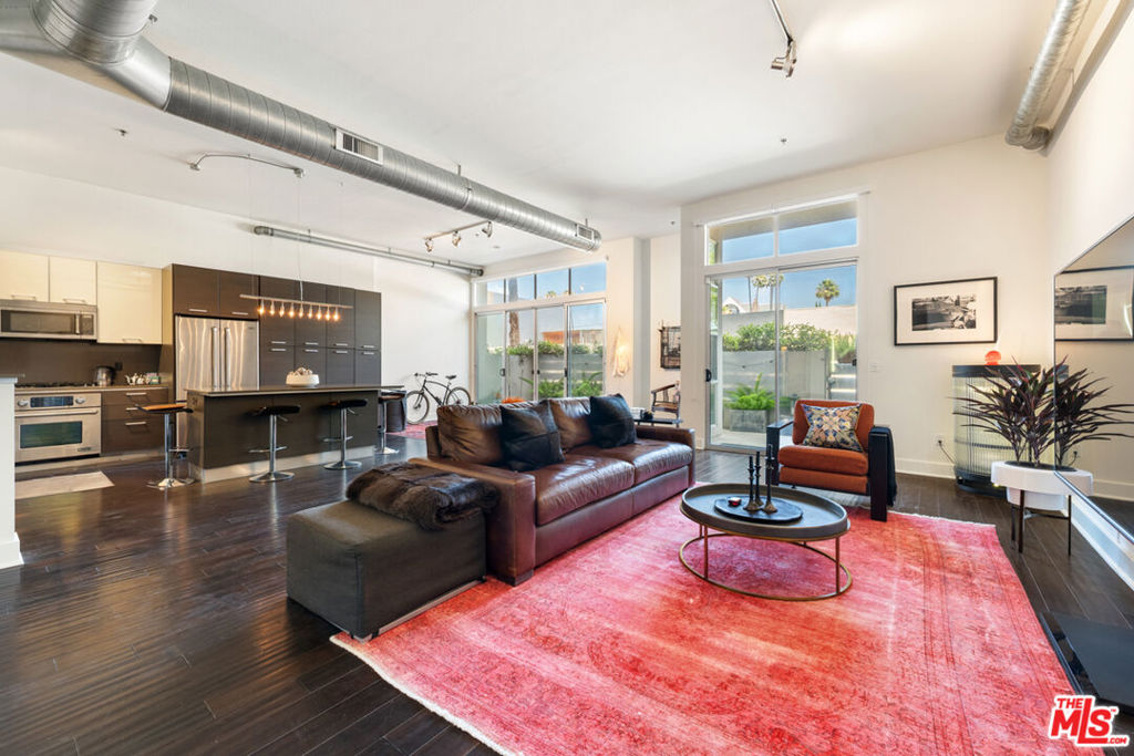 Modern Luxury Loft with direct street access in the heart of Marina del Rey! This is the first time this unit has been on the market since it was initially built. Experience elevated urban living in this beautifully designed 1,200 sq. ft. open-concept floor plan at the sought-after Steel Lofts. The well appointed space offers a rare combination of industrial chic and everyday comfort, featuring; soaring ceilings, hardwood floors, exposed ductwork, and expansive floor-to-ceiling windows that bring in abundant natural light.The kitchen is equipped with top-of-the-line stainless steel appliances, custom cabinetry, and sleek finishes perfect for cooking or entertaining. The spacious layout includes two full bathrooms, one with dual shower heads, the other with a deep soaking tub, plus a full-size washer and dryer in-unit.Enjoy direct gated street access with this ground-floor unit for convenience and privacy, along with two secured tandem parking spaces, plus additional guest parking spaces in a controlled-access garage.Located just minutes from Venice Beach, Silicon Beach, the Marina, Abbot Kinney, and premier shopping/dining, this unit offers the perfect balance of style, space, and location.