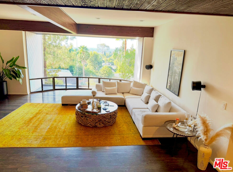 This stunning 3,000 sq ft Sherman Oaks home offers a rare blend of luxury and flexibility. Available furnished or unfurnished, for short- or long-term lease, the home features sweeping valley views, open living with vaulted ceilings, fireplace, and wet bar, plus a chef's kitchen and elegant dining area. The spa-inspired master suite includes a private balcony, while a bonus family room opens to an additional terrace. Outdoor living is elevated with a natural gas fire pit and fireplace. EV-ready garage, whole-house water filtration system, and central air add comfort and convenience. Optional private chef services available. Duplex-style residence with quiet, friendly neighbors. Prime location near Studio City, Encino, and Beverly Hills with easy freeway access.