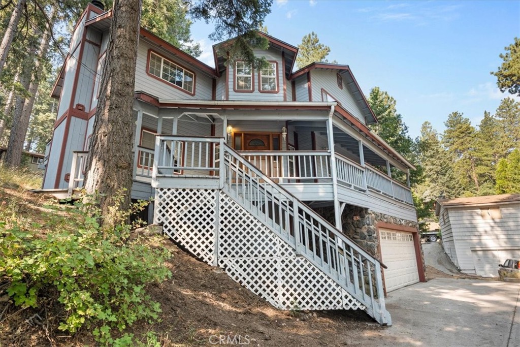 Welcome to 31521 Silver Spruce Dr, a charming mountain retreat with privacy, space & stunning craftsmanship nestled in the heart of Running Springs. This 3 bedroom, 2.5 bathroom, 2,162 sqft home sits on a private lot and offers the perfect blend of rustic charm, thoughtful design, and modern convenience ideal for a full-time residence or a weekend getaway. Step inside to an inviting foyer that opens to multiple living spaces, where rich woodwork, custom craftsmanship, and warm natural light create a cozy, yet spacious feel. A striking stone fireplace anchors the living room and carries through to the primary bedroom, adding character and warmth throughout. The spacious kitchen provides ample room for cooking and entertaining, while the adjacent dining area boasts large windows with picturesque views of mature trees. A perfect backdrop for every meal. Enjoy the outdoors from both the front deck and the rear patio, ideal spaces for morning coffee or evening relaxation under the stars. The attached two-car garage provides direct access into the home, and a dedicated laundry room adds everyday convenience. Upstairs, all three bedrooms are generously sized, including a luxurious primary suite featuring its own private patio, a walk-in shower, jetted tub, and an oversized walk-in closet. Whether you’re looking to enjoy nearby adventures in Big Bear, Lake Arrowhead, or prefer the charm of local cafés, shops, and year-round outdoor recreation this home places it all within easy reach. Don’t miss your chance to own this stunning mountain escape that offers space, style, and serenity in one of Southern California’s most accessible alpine communities.