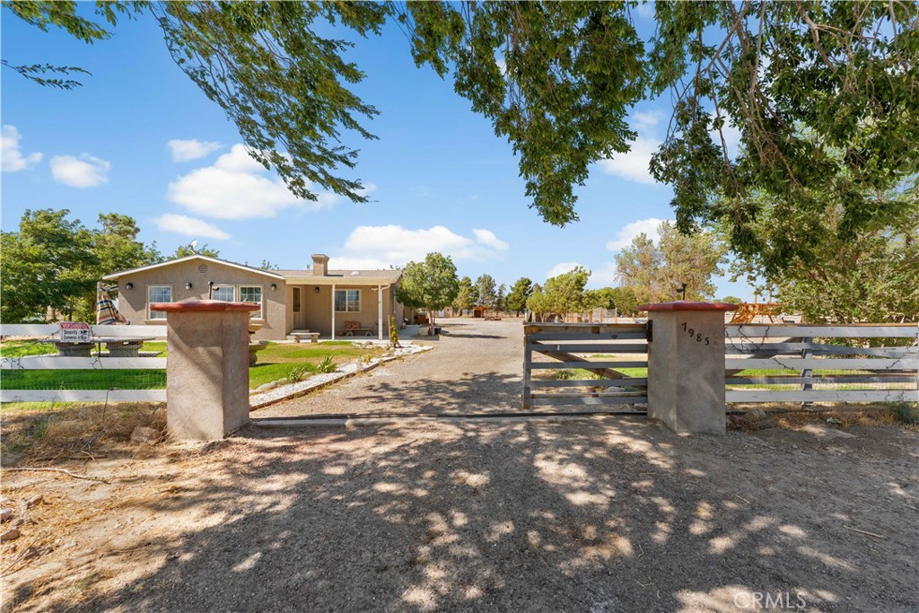 Charming & upgraded 3+2 main home (circa 1930) on 2+ acres in Rosamond! Renovated kitchen w/granite, SS appliances, 6-burner range & oversized fridge. Spacious great rm w/wood floors, built-ins & fireplace. Lux primary suite w/walk-in closet & travertine baths. Private 1+1 guest house perfect for visitors or rental. Plenty of space for RVs, animals & projects. 2-car garage, paved driveway. E(2½)R zoning allows rural/equestrian use. Close to Willow Springs Raceway, Drift 101, wineries, dining & AV Poppy Reserve.