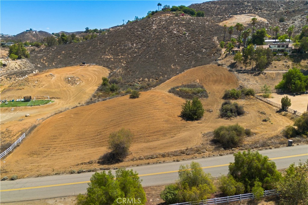 Great Opportunity to Build Your Dream Estate by Lake Mathews! This hillside parcel captures lake and mountain views. This land offers endless potential, whether it’s a custom luxury home with a resort-style pool, an equestrian haven, or a private botanical retreat. Experience the privacy of a peaceful rural setting while remaining only a short distance from shopping, dining, and freeway access. With no HOA restrictions and convenient access, this parcel gives you the freedom to create the lifestyle you’ve always envisioned.
