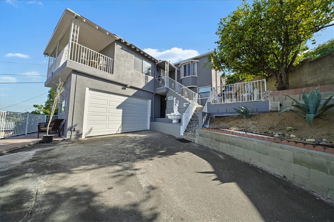 MULTIGENERATIONAL LIVING ON A HILLTOP- VIEWS! VIEWS! VIEWS! + ADU + HUGE LOT!!! **Seller offering CLOSING COSTS!!!** Just recently refreshed with a brand new garage door and a new coat of paint, inside and out! Discover the incredible potential in this charming home, nestled atop a serene hillside in the extremely desirable area of Eagle Rock. One of Northeast LA's most vibrant neighborhoods near the trendy shops and restaurants of York Blvd and Eagle Rock Blvd. This location offers both convenience and a sense of seclusion with a private easement. Just 8 miles from DTLA, 5 miles from Old Town Pasadena, and blocks from Occidental College. Step into a bright and airy great room combining the living room and dining room, where you’ll find a panoramic priceless view of the city sky and lush hills with breathtaking sunset views. From the dining area you’ll step into a sweet kitchen with granite countertops and a bay window creating abundant natural lighting. Flowing from the kitchen is a spacious breakfast nook with access to the private backyard, which can easily be converted into a versatile room- make it your home office, media room, playroom, or additional bedroom. Towards the back is a convenient laundry room, providing a separate access point to the rear patio. The two adequately sized bedrooms each have their own en-suite bathrooms with tile counters, providing a private retreat for you or your guests. Downstairs you’ll find a spacious 632 sq ft ADU with its separate private entrance, boasting two bedrooms and one bathroom. Upon entering you'll find a cozy great room combining the living room, dining room, and kitchen with fairly new maple cabinets. This functional unit even has its own laundry/utility room allowing for complete privacy. Outside, unwind in your private covered patio making it your serene retreat while enjoying some lemons or guavas from your own fruit trees. This unique home has an expansive lot perfect for entertaining friends and family, accommodating numerous cars, or adding multiple ADUs to generate more passive income! Even the attached garage can easily be converted into an ADU as gas and drains already exist. With this property you also get an extra lot with immense potential. There's plenty of space to make this home truly yours. Schedule a showing today and envision the possibilities!
