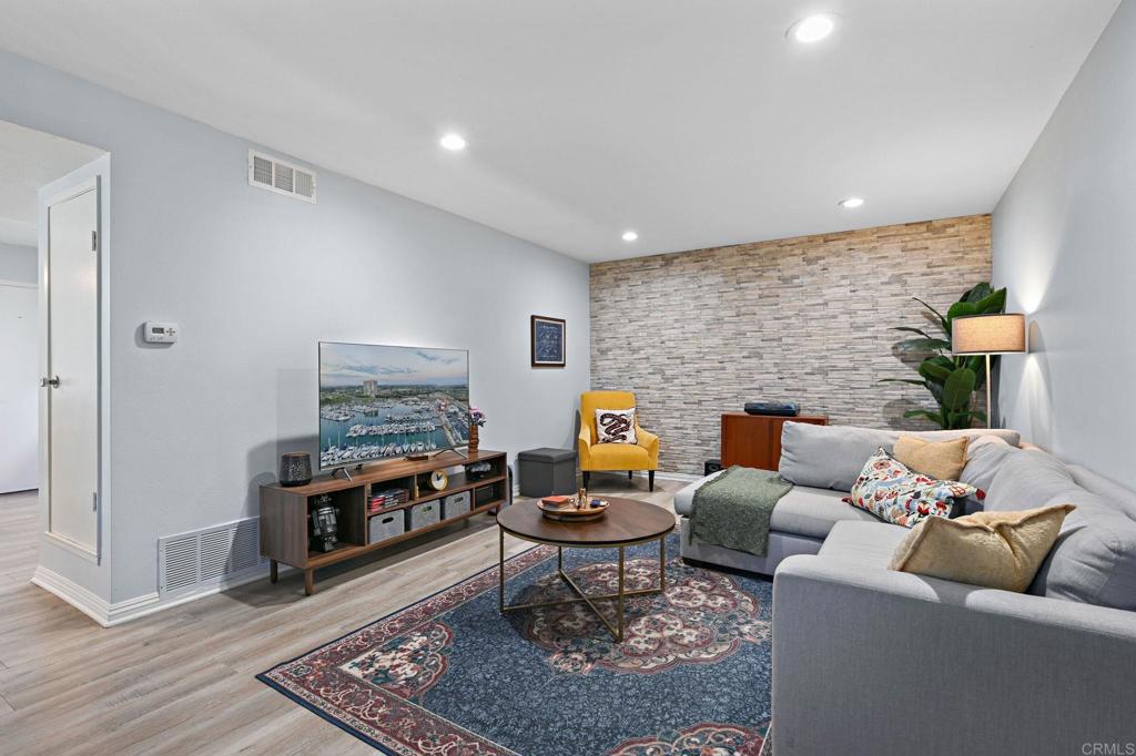 Step inside and instantly feel the vibe! This home isn’t trying to be like the rest. With three bedrooms, one and a half bathrooms, and two stories of thoughtful design, it’s got a cool, collected energy that still knows how to have fun. The kitchen is sleek and stylish, but it’s the oversized walk-in pantry that steals the show. It’s basically a secret room for snacks, staples, and that appliance you swore you’d use more. Just off the dining area is a one-of-a-kind game closet complete with wallpaper, lighting, and shelf bars. Yes, it's as fun as it sounds! Slide open the brand new doors (installed in 2023, along with all the windows) and step into your very own tropical patio escape. String up some lights, throw on some music, and you’ve got a Friday night hangout without leaving home. Upstairs, the primary bedroom comes with a walk-in closet big enough to justify a mini shopping spree. The bathrooms are updated, fresh, and carry the same welcoming style throughout. You’re walking distance to local favorites like Better Buzz, Sprouts, and that dreamy French bakery, with Downtown Vista just a quick five-minute drive away when you're craving a night out or a quick stop at your favorite brewery. Easy access to the 78 and 15 freeways makes commuting a breeze, and Camp Pendleton is just a short drive for military-connected buyers. This home is anything but ordinary, it’s layered with personality, comfort, and just the right touch of bold.