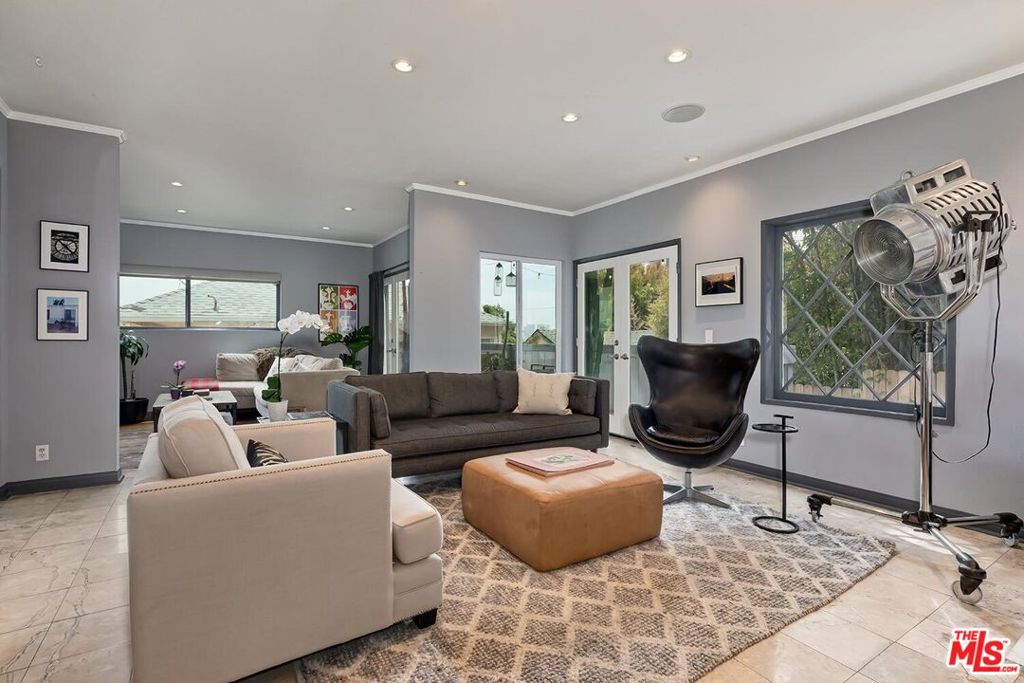 MOTIVATED SELLER / BRING OFFERS! INCREDIBLE OPPORTUNITY ABOVE THE SUNSET STRIP! 1133 North Clark Street #103 is a true real estate gem with VIEWS of West Hollywood and Century City! This beautiful and very spacious condo located just above the Sunset Strip is the ultimate haven. Peaceful and quiet. With a thoughtful layout, this charming 2 bed / 2 bath features a bright living room, two balconies, updated kitchen, two en-suite bedrooms on opposite ends of each other for maximum privacy, in-unit laundry, Central AC/Heat, and side-by-side garage parking with EV charger. Pet-friendly, private, and perfect for entertaining. This home is ideally located in one of LA's most desirable neighborhoods!
