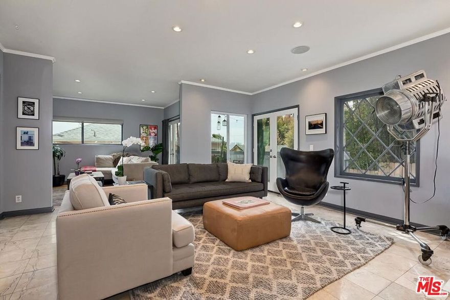 MOTIVATED SELLER / BRING OFFERS!  INCREDIBLE OPPORTUNITY ABOVE THE SUNSET STRIP! 1133 North Clark Street #103 is a true real estate gem with VIEWS of West Hollywood and Century City!  This beautiful and very spacious condo located just above the Sunset Strip is the ultimate haven. Peaceful and quiet. With a thoughtful layout, this charming 2 bed / 2 bath features a bright living room, two balconies, updated kitchen, two en-suite bedrooms on opposite ends of each other for maximum privacy, in-unit laundry, Central AC/Heat, and side-by-side garage parking with EV charger. Pet-friendly, private, and perfect for entertaining. This home is ideally located in one of LA's most desirable neighborhoods!