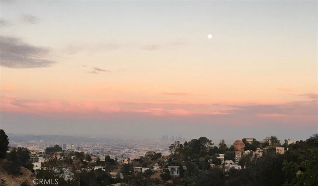 Sought after location in the ionic Hollywood Hills area with exceptional views of downtown LA and neighboring city lights buildings. The sunsets are
breathtaking. This LAR1 zoned lot is on a gentle slope with a level portion for easy building. Currently a paper street lot. Several access points but will need a road paved for building requirements from the city. The land can also be used as a peaceful meditation area surrounded by nature. Buyer to perform their own due diligence.
