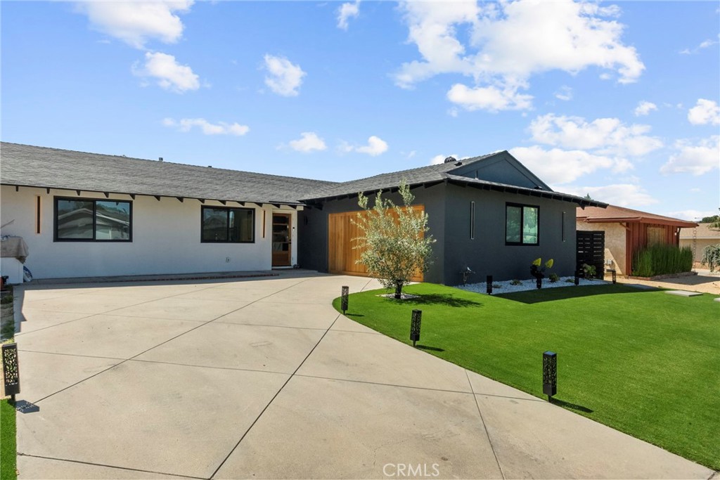 Fully remodeled with a modern aesthetic, this stylish single-story 3-bedroom, 2-bathroom home offers a thoughtful blend of comfort, design, and functionality in one of Simi Valley’s most convenient neighborhoods. The home features light-filled interiors with brand-new flooring, fresh paint, and an open layout that enhances both daily living and entertaining.
A sleek fireplace adds warmth and character to the main living room, while the open floor plan provides ample space for hosting. The updated kitchen and bathrooms are finished with modern fixtures and materials, creating a clean and cohesive design throughout. The spacious primary suite features a walk-in closet and a fully remodeled en-suite bath, while two additional bedrooms provide flexibility for guests, office space, or hobbies.
Outside, enjoy your own private, newly refinished pool, perfect for sunny California days, along with an oversized driveway offering generous parking and storage options. Conveniently located near parks, schools, shopping, and freeway access, this move-in-ready home is a perfect fit for modern living.