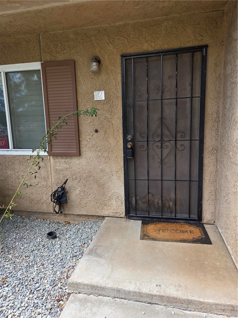 Welcome all first-time home buyers and Investors! If you are looking for a starter Condo, then this is the place! This property features a spacious living area featuring a living room, with Plantation shutters, with newly vinyl flooring in both the living and dining areas, separate dining area, located next to the kitchen, one bath downstairs with an indoor laundry area located within the bathroom for your convenience. Two good size bedrooms, both located upstairs. A large balcony is located off the Primary bedroom. A full partially renovated bathroom. One of the bedrooms has not one, but two closets, one being a walk-in closet. Carpet throughout the upstairs. There is a carport, with two parking spaces and two storage units. The HOA covers trash, water and groundskeeping. Located near Freeway and shopping areas. Don't miss this opportunity!