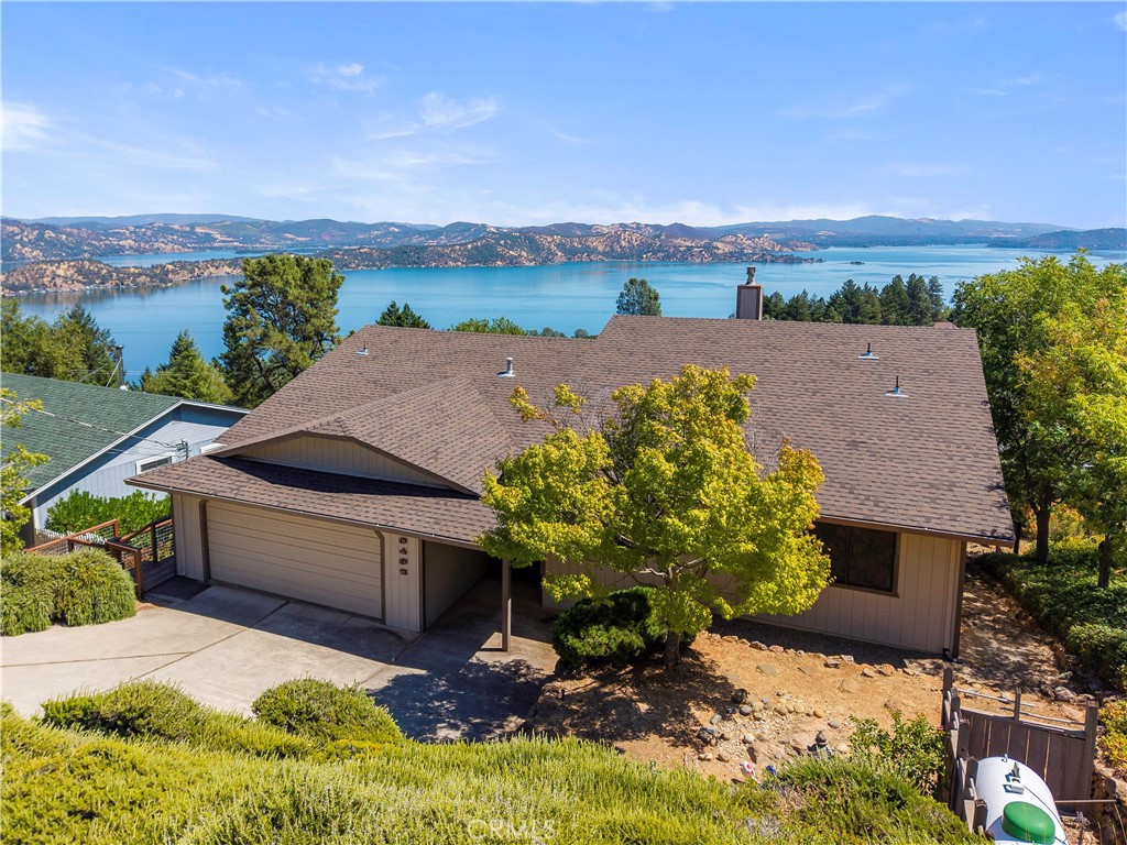 Welcome to one of the best lakeview homes in Kelseyville! This beautifully designed residence offers bigger and better Clear Lake views from nearly every room, along with an excellent floor plan for comfort and entertaining. The open living room and kitchen are the heart of the home, featuring a cozy freestanding stove and sweeping windows that frame the sparkling lake. Large kitchen with newer stainless-steel appliances and pantry. Step right out to the brand-new, covered redwood wraparound deck and take in panoramic views that stretch for miles—perfect for morning coffee, sunset dinners, or year-round relaxation. A short step-up leads to the private bedroom wing, where two inviting guest bedrooms and a full bath provide space for family and friends. The primary suite is a true retreat, complete with its own bath and yet more dazzling lake views to wake up to each morning. Main floor also includes formal dining with lake views, inside laundry room, an additional half bath. Downstairs, you’ll find a versatile bonus room with half bath ideal as a guest bedroom, hobby room, or home office with access to the lower deck. Central Heat and Air plus a newer roof, attached two-car garage and fully fenced yard add to the convenience and livability. Enjoy all the benefits of Riviera West, including a clubhouse, swimming pool, and private boat launch. With its unbeatable views, thoughtful layout, and expansive deck for indoor-outdoor living, this Greenwood Drive home captures the very best of the Lake County lifestyle.