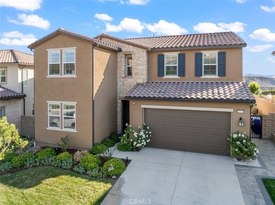 This beautifully upgraded view home checks all the boxes, Owned and Paid Solar, No Mello Roos, and loaded with standout features throughout. No neighbors across the street. From the moment you enter, you’ll appreciate the open layout, elegant flooring, and stylish touches like recessed lighting and wrought iron stair rails. The spacious kitchen is a dream with quartz countertops, a center island, and stainless steel appliances, flowing seamlessly into the large family room and out to the California room with tile flooring, perfect for entertaining. Enjoy outdoor living in the generous backyard with multiple sitting areas. Downstairs offers a full bedroom and bathroom, ideal for guests or multigenerational living. Upstairs, a large loft offers flexible living space, and the primary suite is a retreat of its own with a private balcony featuring stunning views and a spa-inspired bathroom to start or end your day in luxury. Additional highlights include wood shutters, dual golden zebra shades that preserve views, and so much more. This is a home you won’t want to miss!