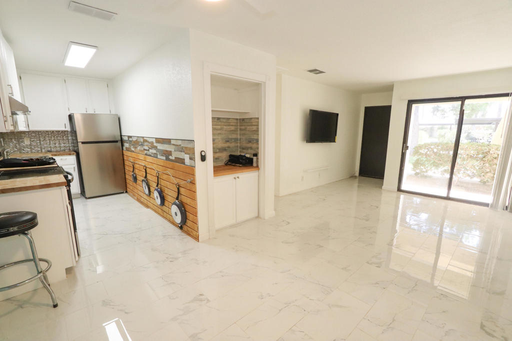 Move-in ready ground floor 1 bedroom / 1 bath condo located in a secure gated community just minutes from the vibrant downtown strip. Enjoy resort-style amenities including sparkling community pools, relaxing spas, and tennis courts. This well-maintained unit features a brand-new AC system and comes equipped with a refrigerator, oven, stove, and microwave.
