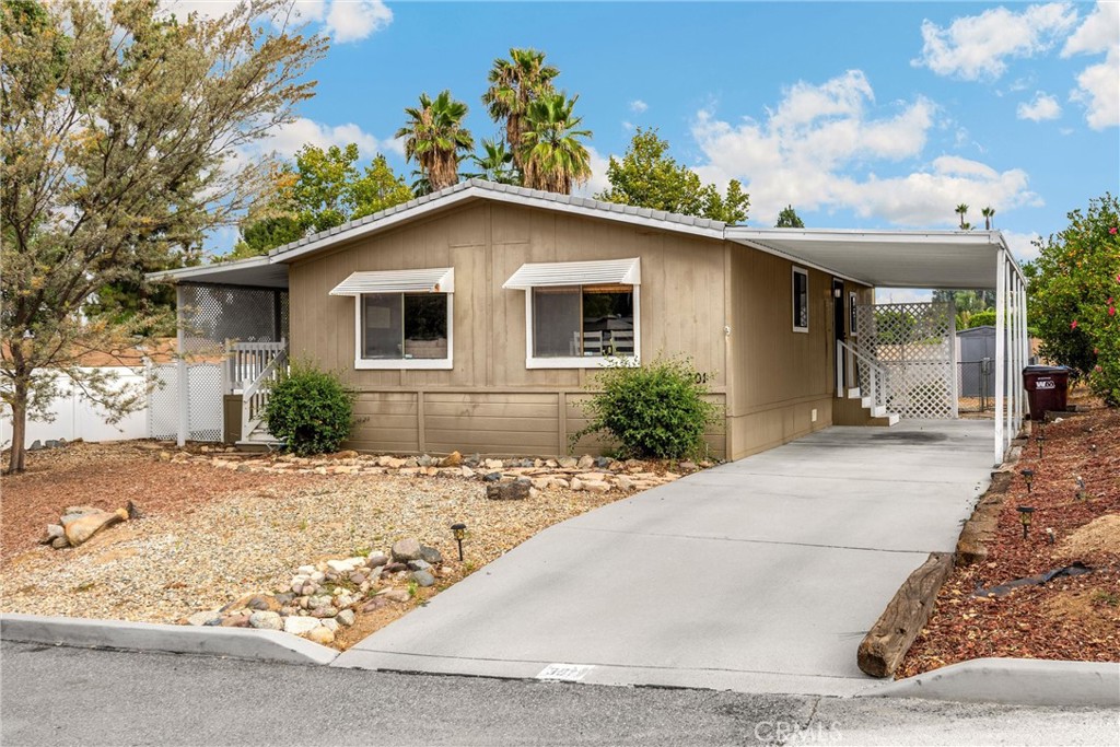 Welcome to this charming home in the highly desirable Rancho Caballero Mobile Home Park! Featuring 2 spacious bedrooms and 2 bathrooms, this cozy residence offers a comfortable and functional layout. The primary suite includes its own private bathroom and a generous walk-in closet. The open concept living area flows seamlessly into the kitchen, creating a warm and inviting space for relaxing or entertaining. Situated on a spacious lot, the home boasts a large backyard full of potential and a beautifully landscaped front yard with decorative rock accents. The extended driveway easily accommodates up to three vehicles. Rancho Caballero is one of Riverside’s most sought-after communities, offering resort-style amenities including two swimming pools, a relaxing spa, clubhouse, tennis court, two pickleball courts, and more. Don’t miss your chance to own a home in this vibrant and welcoming neighborhood—schedule your tour today!