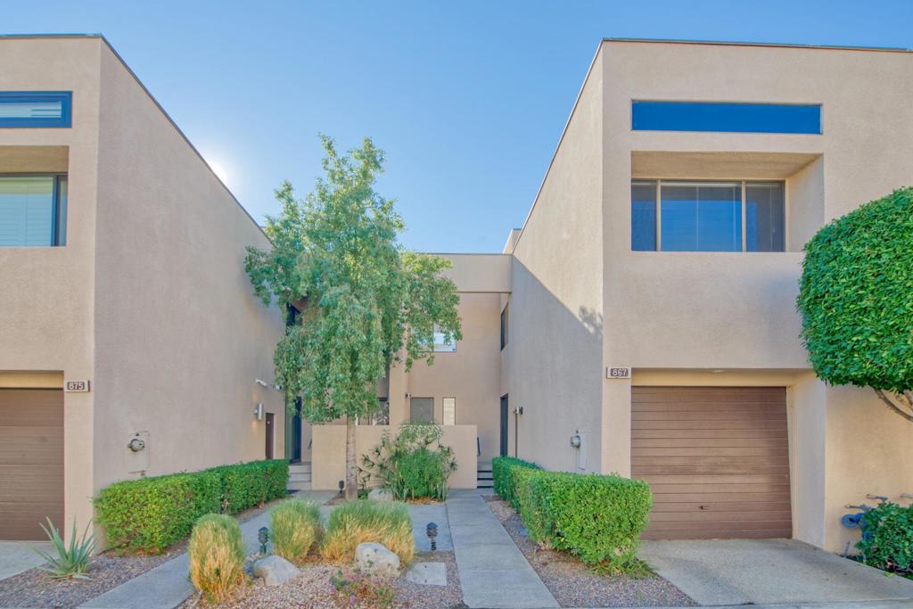 A chic peid a terre in Palm Springs! This lovely loft style 2 bedroom / 2 bath home at Village Racquet Club!! This townhome is 2 stories tall- divided into 4 split floors. With over 1600 square feet of living space, this townhome is located in central Palm Springs just blocks away from the city's best restaurants and nightlife. The main level living room has a fireplace and vaulted ceilings that open to a private balcony with mountain views. Enjoy the privacy of the quiet terrace level den, dining area, and intimate courtyard. The custom upgraded kitchen features stainless appliances and gas cooktop. The oversized primary suite has an extention, perfect for a home office or reading room, along with two walk-in closets. The home has a private, oversized one-car garage wit laundry. Village Racquet Club has 8 pools and spas, tennis and racquet ball courts, gym, and a clubhouse all within a beautifully landscaped, gated community. Perfect for a 1 month+ vacation rental income property-or- year round home.