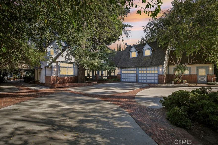 Amazing opportunity to own this elegant gated Country English Estate in prime Encino on a 27,000+ sqft flat lot!  So much charm and character, as if from a bygone era!  Voluptuous woodwork and craftsmanship throughout.  Luxurious yet cozy, a home to be “lived in”, with too many features to mention.  Including the main house, attached upstairs guest suite w/bath, attached studio guest house with full kitchen and bath, pool cabana with another full bath, a separate-entrance detached luxurious suite of offices (convert to recording studio?!), and even a resort style spa retreat (with sink vanity, toilet room, shower, sauna, overhead heaters, and a huge jacuzzi).  Massive yard with mature landscaping, English gardens, masterful brickwork galore, and a sparkling over-sized marble accented pool.  At the front of the property enjoy the ease of a circular drive with double gates, a motor court for 7 cars, leading to 3-car garages and a Porte Cochére.  At the back of the manor step out to a romantic patio perfect for Al-fresco dining, then through the old-world iron gates to the gardens and pool complex beyond.  This compound is perfect for multi-generational living, caretaker living quarters, home office-studio…the possibilities are endless.  Coveted Hesby Oaks K-8 school.  Nestled amongst newly built and remodeled multi-million-dollar homes. Move in just as it is or revitalize this astounding property…or develop the site with one or two new homes. Either way, it is an opportunity that won’t last.  Easy to show, schedule a private showing with me directly, at any time.
