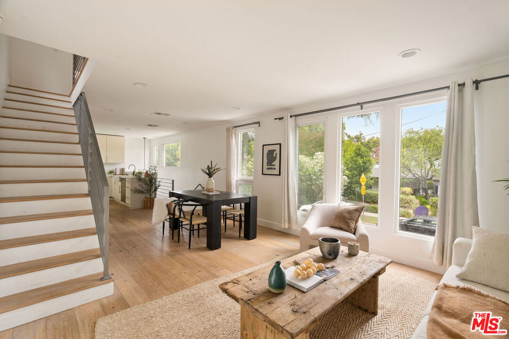 Come see this bright, open-concept three-bed, three-bath home located in the Silver Triangle of Studio City and the Carpenter School District with a walk score of 88. Stroll home on a tree-lined street to this beautifully updated home offering indoor/outdoor living with the main level opening to a private back yard with lush landscaping and plenty os space to entertain. This charmer has wire-brushed oak floors, quartz countertops, a farmhouse sink, spa-like over-sized showers, a tankless water heater, nest thermostat, a Tesla charger, extra storage, and more. The top floor offers two generous-sized bedrooms, while the first floor has a third bedroom with a private bathroom, perfect for an office or guest suite. Recent updates include a new roof under a 10 year warranty, new HVAC also under a 10 year warranty, a carport conversion into a secure garage, designer fixtures, and a freshly sealed back patio. Come see this gem today!