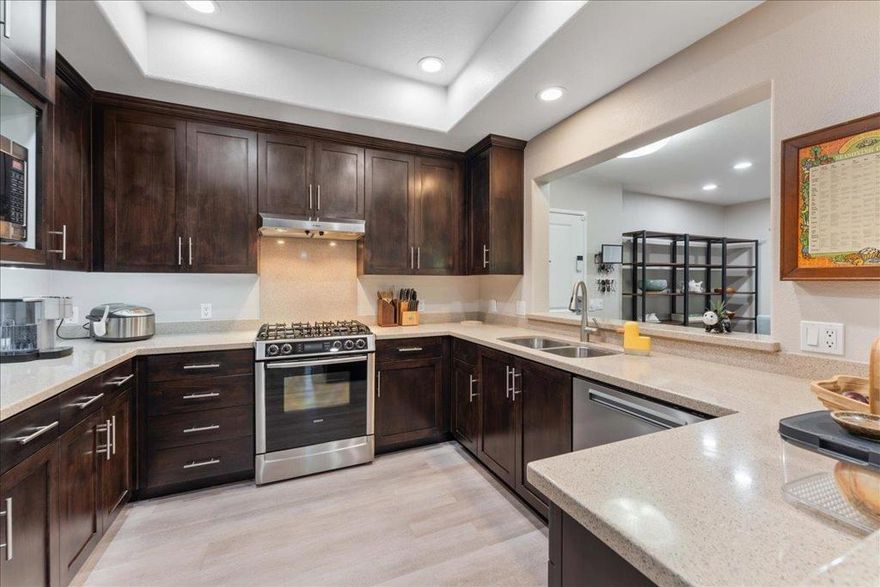MOTIVATED SELLER - PRICED AT 100K UNDER LAST SALE PLUS SELLER WILL CREDIT BUYER FIRST FULL YEAR OF HOA FEES WITH ACCEPTED OFFER BEFORE 12/31/25!! 100% Move-in-ready 1,414 square foot condo, features 2 bedrooms, private office, 2 full baths, plus a 50-foot patio accessible from living room, office, & primary suite. Meticulously maintained with over $35K in upgrades, including new HVAC, updated flooring, new refrigerator, dishwasher, & washer/dryer. Larger than most Onyx homes, the home offers expansive living and dining areas, & gourmet kitchen with Espresso cabinets & gleaming granite counters. The private office, opposite the kitchen, is a full room with its own patio access; ideal for remote work, guests, or creating a flexible retreat. The expansive patio is framed by trees & hedges, and extends your living space outdoors while maintaining privacy. Ground-level convenience but still elevated above street level provides ease without sacrificing security. Additional comforts include central A/C and two secure parking spaces. Residents enjoy close proximity to community amenities, with the fitness center 2 doors down, & the community room next door. Incredible value in prime Campbell location, steps from Pruneyard's shops and dining, LG Creek Trail, & vibrant downtown Campbell.