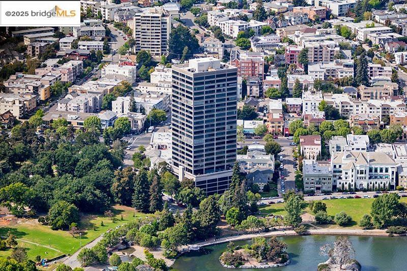 Welcome to Park Bellevue's newest panoramic Lake Merritt and San Francisco Bay view masterpiece! This 3 bedroom 3 bath, plus was thoroughly and beautifully renovated. Enter the open light filled kitchen that has an island waterfall quartz countertop, Wolf Oven with induction cook top, built in Thermidor refrigerator, Miele dishwasher, Wolf microwave and custom inset ceiling fan that preserves the panoramic views from the kitchen. Custom cabinets with soft close and bar sitting area make this one of the best kitchens you will ever find in a condominium! The great room includes large family room to entertain and dining area to large enough to host friends and family events. Primary bedroom suite is extremely spacious and includes a walk in closet with customs cabinets. There is an ensuite second bedroom with generous closet space and custom bath. The 3rd bedroom has been turned into an office. All the bedrooms are light filled with gorgeous views of Lake Merritt. In unit laundry room with custom cabinets, hardwood floors throughout and motorized window coverings finish off this amazing property. This is a must see! In addition, you get Park Bellevue's panoramic view pool and deck, sauna, fitness center, club room and 24 hr security. This is true luxury living at its best! Views: Downtown