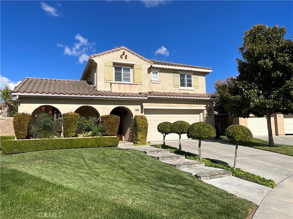 Welcome to this stunning, upgraded two-story pool home located in the heart of Eastvale, California. This property boasts 5 generous bedrooms with plenty of bathrooms; the home offers ample space for family and guests. The design features an open-concept layout with high ceilings, windows for natural light, plantation shutters and crown molding throughout! Upstairs loft that includes a custom-built desk. The kitchen is equipped with all the appliances you need, a large island and custom cabinetry...perfect for entertaining. Inviting outdoor space that includes a beautifully landscaped pool, custom outdoor grill, and firepit on one side, step through the gate to other side of backyard to 5 fruit trees, garden area, sounds from the waterfall to enjoy! Theres so much more, this is a must see!!