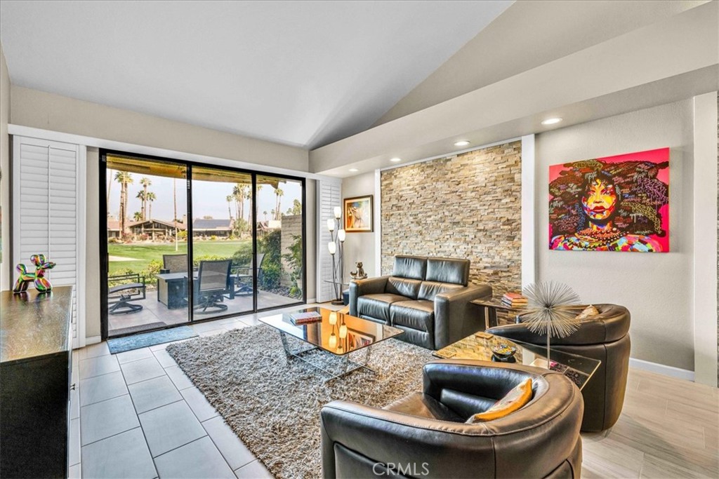 Welcome to The Lakes Country Club! This truly move in ready, 2 Bedroom, 2 Bath, approximately 1,368 sq ft Cheyenne floor plan checks all the boxes - it is a gem! Enter the gated courtyard to find a professionally landscaped retreat, complete with custom lighting and beautiful tiles. You will be captivated by the refined, contemporary finishes and soft, neutral tones which provide a soothing, welcoming esthetic to this home. With vaulted ceilings, an open floorplan and porcelain tile throughout, this home feels spacious and roomy. The main attraction is the stunning views of the lush golf course, a striking water feature and peek-a boo mountains. You can relish in all of this from the handsomely tiled patio – a perfect place for relaxing or entertaining! The kitchen is attractively finished with custom Shaker cabinets, Kitchen Aid appliances and granite countertops. Both bathrooms are nicely updated with attractive showers and vanities. An elegant stone wall accents in the main living area add, texture and interest to the area. Don’t miss the opportunity to make this stunning and sophisticated home your new Desert retreat! The Lakes Country Club offers a robust schedule of social and fitness activities at the exquisite Clubhouse and Health and Wellness Center. Enjoy Tennis, Pickleball or Pop Tennis, Bocce or the 44 community pools and spas. For golfers, the Club offers membership options for the 27 hole championship golf course. Don’t miss this rare opportunity – schedule your private tour today and make your dream home a reality!