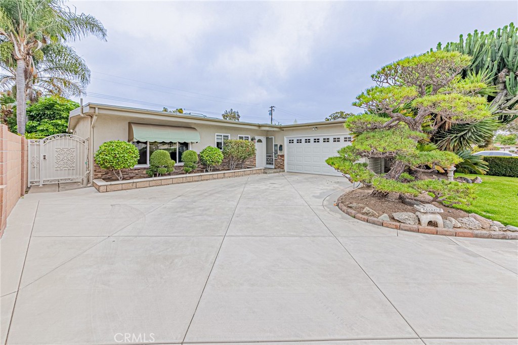 Nestled in a desirable neighborhood in Garden Grove, 12256 Lesley St presents an exceptional opportunity for buyers seeking a move-in-ready single-family residence with classic charm and impressive curb appeal. This well-maintained home, built in 1963, features approximately 1,500 square feet of living space on a generous 7,600 square foot lot. With its combination of attractive landscaping and a thoughtfully designed interior layout, the property stands out as an outstanding value in today’s market. The residence boasts three comfortable bedrooms and two bathrooms, providing ample space for families, couples, or those needing a dedicated home office or guest room. The floor plan is both practical and inviting, with an easy flow between the public and private areas of the house. Large windows throughout allow natural light to brighten each room, creating a welcoming and cheerful atmosphere. Upon arrival, visitors are greeted by nicely landscaped front and rear yards, offering lush green lawns, mature shrubs, and tasteful plantings that enhance privacy and the overall character of the home. The curb appeal is undeniable, with the property’s thoughtful landscaping setting it apart from neighboring properties. Whether hosting outdoor gatherings, enjoying a morning coffee on the patio, or letting pets and children play in the secure backyard, the outdoor spaces are equally suited for relaxing and entertaining.
Additional features of the property include an attached two-car garage, providing secure parking and extra storage options, as well as an extended driveway for additional vehicles or guest parking. The home’s exterior and landscaping have been meticulously maintained by the current owners, reflecting their pride in ownership and commitment to upkeep. Located in a quiet and established neighborhood, 12256 Lesley St benefits from its proximity to local schools, parks, shopping centers, and major transportation routes, making daily errands and commutes convenient. The area is known for its community feel and long-standing residents, providing a sense of security and belonging.
