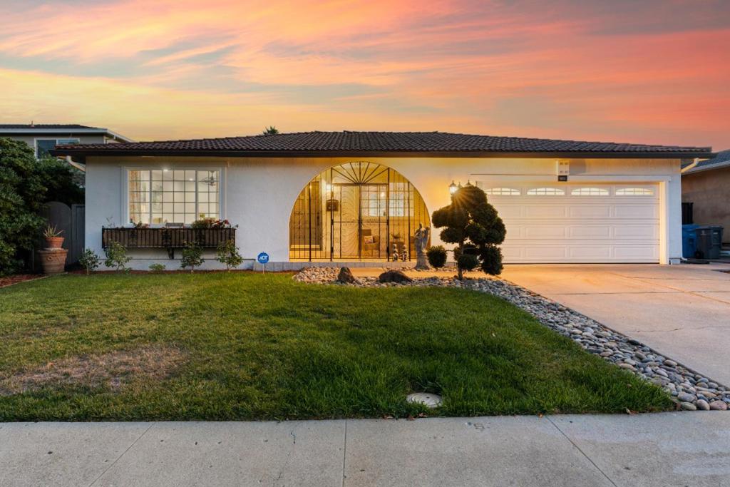Exuding sophistication, this recently remodeled home in Cupertino is one you wont want to miss! Enter an inviting interior finished in crisp white tones, recessed lighting, and honey-colored wide plank flooring. Avid entertainers will love the seamless flow between the living room with its expansive window and the intimate dining area. In the family room, skylights fill the vaulted ceilings with brilliant sun, while a brick fireplace keeps you warm. The kitchen has ample cabinetry, a herringbone backsplash, and a two-seater breakfast bar. Glass sliders whisk you to the pergola-covered terrace for al fresco meals. Your primary suite features a sitting area, built-in storage, patio access, and a large 5-piece ensuite. Notable items include an attached 2-car garage, remote blinds for the family room skylights, and state-of-the-art LED mirrors. Close to parks, shopping, freeways, and schools, everything you need is moments away.