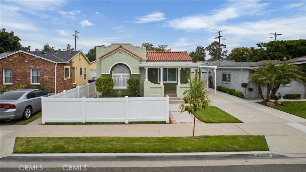 Absolutely impeccable single level home with patio addition that shows like a model home! Everything has been remodeled including this impressive kitchen with stainless steel appliances, all new cabinetry, pull out shelving, quartz countertops and new fixtures! Every square inch of this home has been lovingly maintained! This home has so much character from it's Spanish architecture, to the beamed ceilings, archways and covered porch! There is a brand new roof, new central air and forced air heater, new plumbing, new double paned windows, newly remodeled bathroom, flooring and paint! The back yard features a Trex deck patio and plenty of room! Two spacious bedrooms, one with mirrored wardrobe doors and second with walk in closet. There is a private driveway and a single car garage plus an additional storage room. Welcome home!