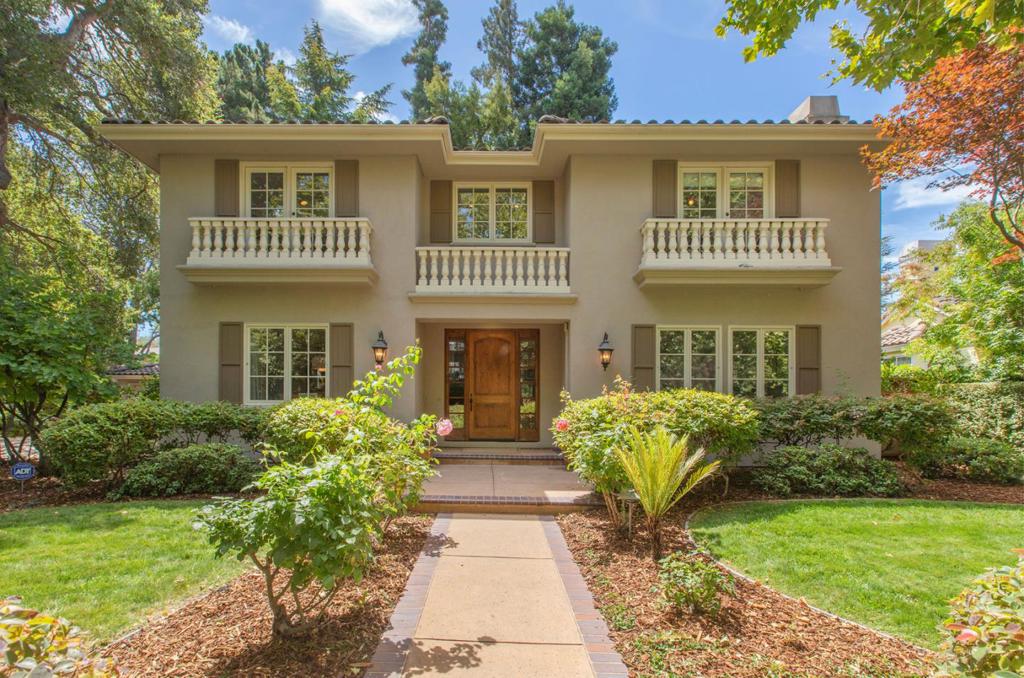 Southern comfort is to be experienced in this gracious, mediterranean style home. Located along a Sycamore lined street, and anchored by a heritage oak, the two story stucco home has two symmetrical second story balustrades reminiscent of a true estate. The large, welcoming foyer is flanked on either side by a large living room with fireplace and a large formal dining room. In the center of the home, The kitchen with island and counter seating ties together the family room with fireplace and the breakfast room with curved bay windows. The fifth bedroom, currently without closet, adjoins the full hall bath. Also on this floor is the powder bath, the laundry room and a convenient side entrance. The upstairs landing includes a window seat. Upstairs three delightful bedrooms share the hall bath, the large primary suite includes an alcove for a reading. The spacious bath includes dual sinks, an oversized jetted tub, shower, and a separate room for the w/c. The spacious walk-in closet includes built-ins. The charm extends to the backyard with beautiful plantings, a large patio covered by an arbor and built-in refrigerator and barbeque. A long driveway leads to the detached two car garage with plenty of room for additional cars.