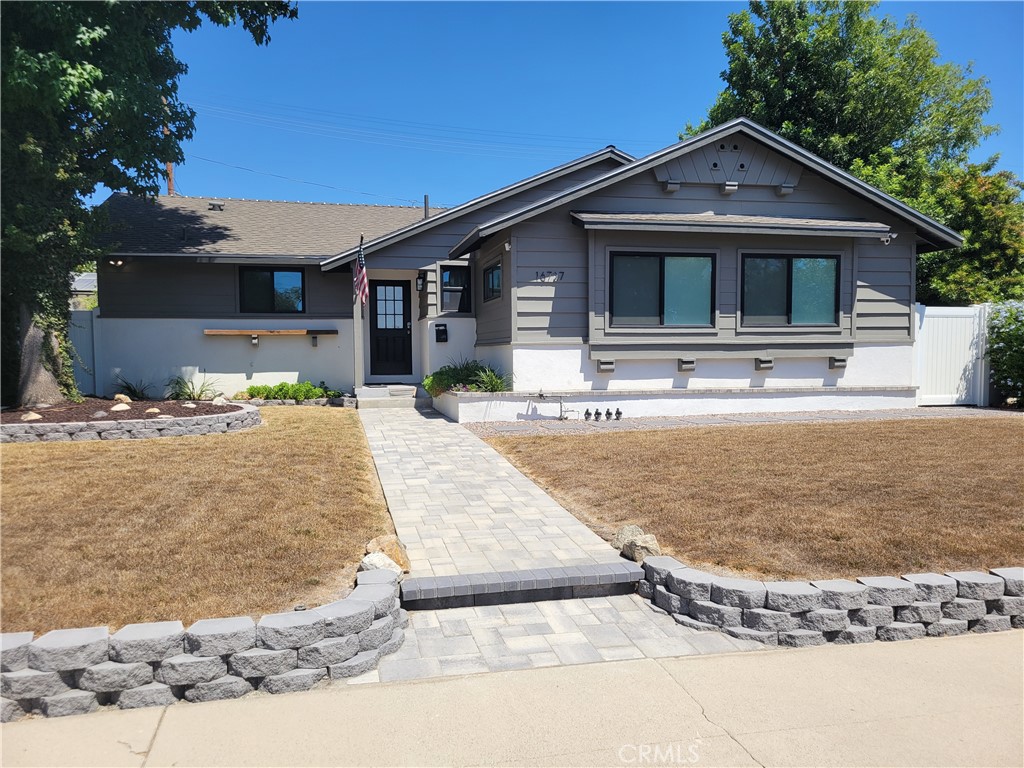 Custom remodeled Granada Hills home with no expense spared offering 3 Bedrooms & 2 baths. Bright and open floor plan. Gourmet center island kitchen with stainless steel appliances and built in mini refrigerator / wine cooler. Oversized dining room opens to the living room. French doors lead to the backyard letting in plenty of natural light. Primary bedroom with private bath, large walk-in closet and door leading to the backyard.
Engineered wood floors, recessed lighting, ceiling fans throughout. Professionally landscaped yard ideal for entertaining with custom concrete, stonework, artificial grass and fruit trees. 2 car detached garage with separate gated additional parking. Ideal property to add an ADU.