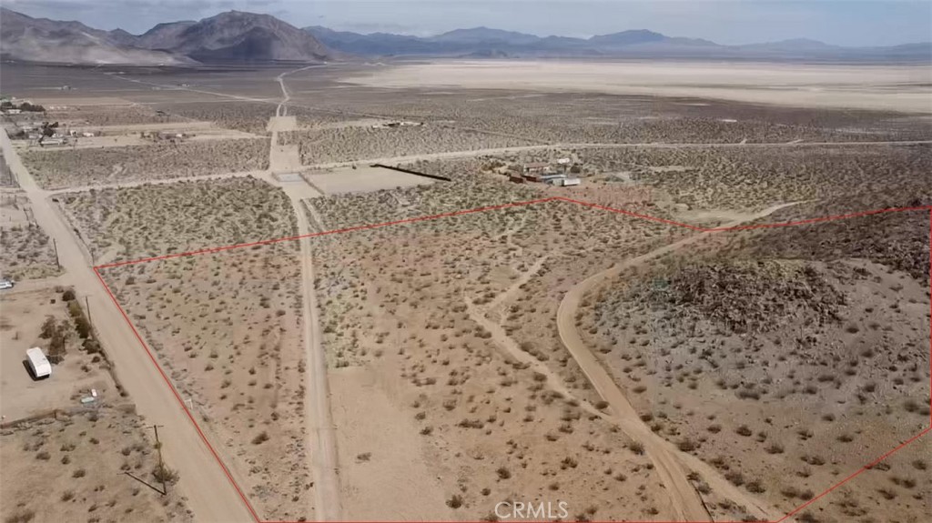 A must see 9.7AC residential lot, you get your own hilltop for the great views and acres of flat buildable land ready for you to build your dream home. Located in an exclusive area called "The Cove", it brings with it much quieter winds and roads as the near by hills create a natural windbreak. Do you like off-roading? There are LEGAL trails near by. Do you like to wind sail? You can do so on the "Dry Lakes". This property is located on the North side of Big Bear and therefore, expect an easy drive up the mountain to accommodate most outdoor sports depending on the time of year. The location of this property is very private yet very accessible! Lots of room to ride horses here because typically there isn't anyone on the road. Bring all your desert toys and enjoy what the desert has to offer. Our team can help you with a new Manufactured Home if developing interests you, bring your contractor and let's talk financing options. Swing by to see it yourself and call if you have any questions.