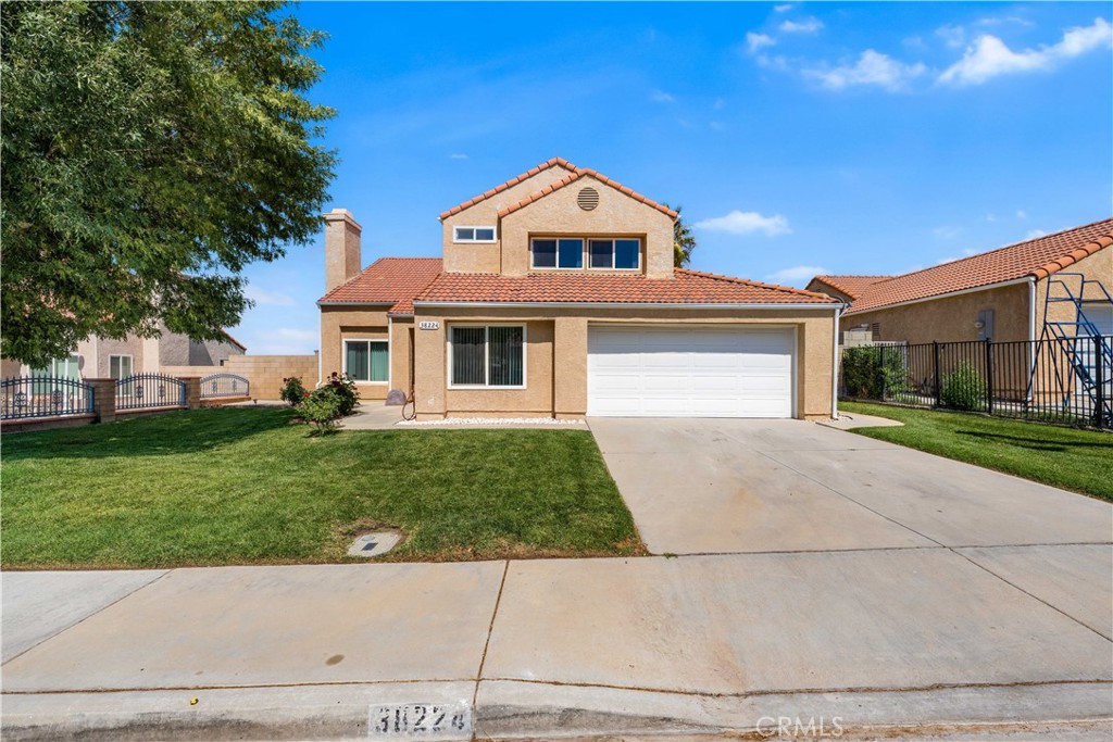 Located in a desirable community adjacent to Palmdale Regional Hospital, this beautiful two-story home offers over 1,900 square feet of thoughtfully designed living space. From the moment you enter, you’ll feel the inviting warmth and comfort of this well-maintained home.
Step into the cozy living room, complete with a charming fireplace that opens to a spacious dining area—perfect for family gatherings. The U-shaped kitchen features sleek granite countertops and overlooks the family room, creating a great flow for entertaining.
Downstairs, a bonus room provides flexible space that can easily serve as a fourth bedroom, home office, or guest area.
Upstairs, enjoy three generously sized bedrooms and two full bathrooms, connected by a beautifully crafted wood floor staircase. Modern dual-pane windows and a new central air conditioning unit help keep the home energy-efficient and comfortable year-round.
Step outside to a large backyard, thoughtfully designed with low-maintenance concrete slabs, a spacious covered patio ideal for summer shade, and mature trees including a fruit-bearing peach tree and a tall palm tree that add charm and character.
Located with easy access to the 14 Freeway, major shopping centers, and the Antelope Valley Mall—this is truly a place to call home at last.
Call today for more details and to schedule your private showing!