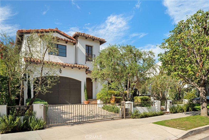 Welcome to this gated, Tuscan-inspired estate, located on a quiet, tree-lined street in the highly sought-after Colfax Meadows neighborhood of Studio City. Step inside to discover an open-concept floor plan that seamlessly blends timeless design with modern amenities. At the heart of the home lies a stunning chef’s kitchen equipped with top-of-the-line appliances, an oversized island, sun-drenched breakfast nook and large walk-in pantry. A convenient butler’s pantry connects to the spacious formal living and dining room, the perfect space for hosting unforgettable gatherings. The inviting family room features two sets of French doors that open to your private entertainers backyard, complete with a fenced-in pool/spa, built-in BBQ with bar seating and lush grassy yard. Upstairs, you’ll find four well-appointed bedrooms, including a luxurious primary suite boasting a custom walk-in closet and spa-inspired ensuite bathroom with a steam shower, jetted soaking tub and double vanity. Additional highlights include a main-level ensuite bedroom, temperature-controlled wine room, dedicated laundry room, a security system and two-car garage. This property is located within the top-rated Carpenter School District and just moments from Tujunga Village, Ventura Blvd, NoHo Arts District, the Studios and so much more.