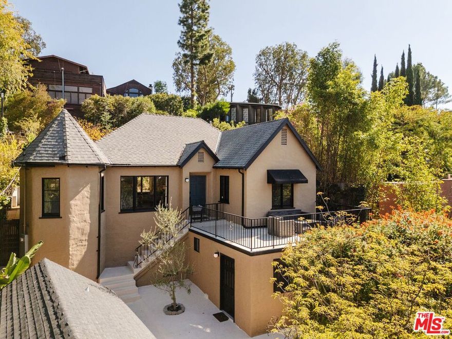 Set in a peaceful hillside pocket of Eagle Rock, this 1928 Tudor home blends timeless character with modern upgrades and sweeping views. The main house features two bedrooms, two bathrooms, and a flexible layout filled with natural light and period charm. Details like arched doorways, a decorative fireplace, and original hardwood floors create a warm, inviting atmosphere, while thoughtful updates bring everyday comfort. The living and dining areas offer treetop vistas and an easy flow, with a cozy reading nook that captures the morning light. The kitchen retains its vintage soul while offering stainless steel appliances and ample storage. Just off the kitchen, a bonus nook makes a perfect pantry or small office setup. In addition to the main house, a detached bonus room with a 3/4 bath offers endless flexibility  ideal for a home office, studio, or guest space. The converted garage adds even more versatility and can be used as a second creative studio, home gym, workspace, or for traditional parking if needed. Out back, terraced gardens and native landscaping create a private oasis perfect for dining, relaxing or entertaining. Modern amenities include central heat and air, updated systems, an EV charger, and laundry on site. Located within the Dahlia Heights Elementary school district and just blocks from Eagle Rock favorites like Cindy's, Found Coffee, Little Beast, and Trader Joe's, this lease offers classic Los Angeles living in one of the Eastside's most beloved neighborhoods.